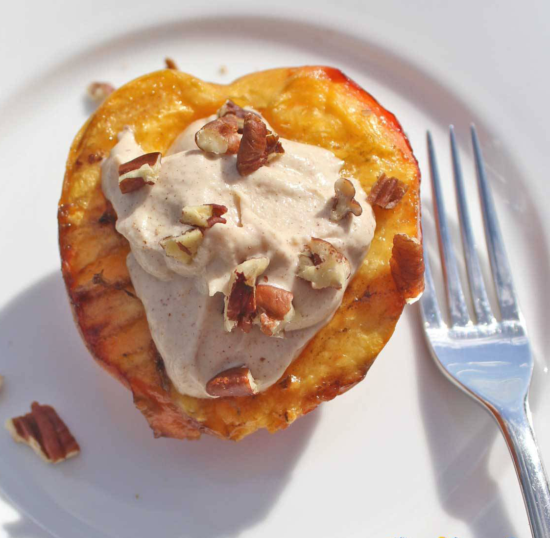 Serve the grilled peaches with a dollop or two of the cinnamon ricotta crème